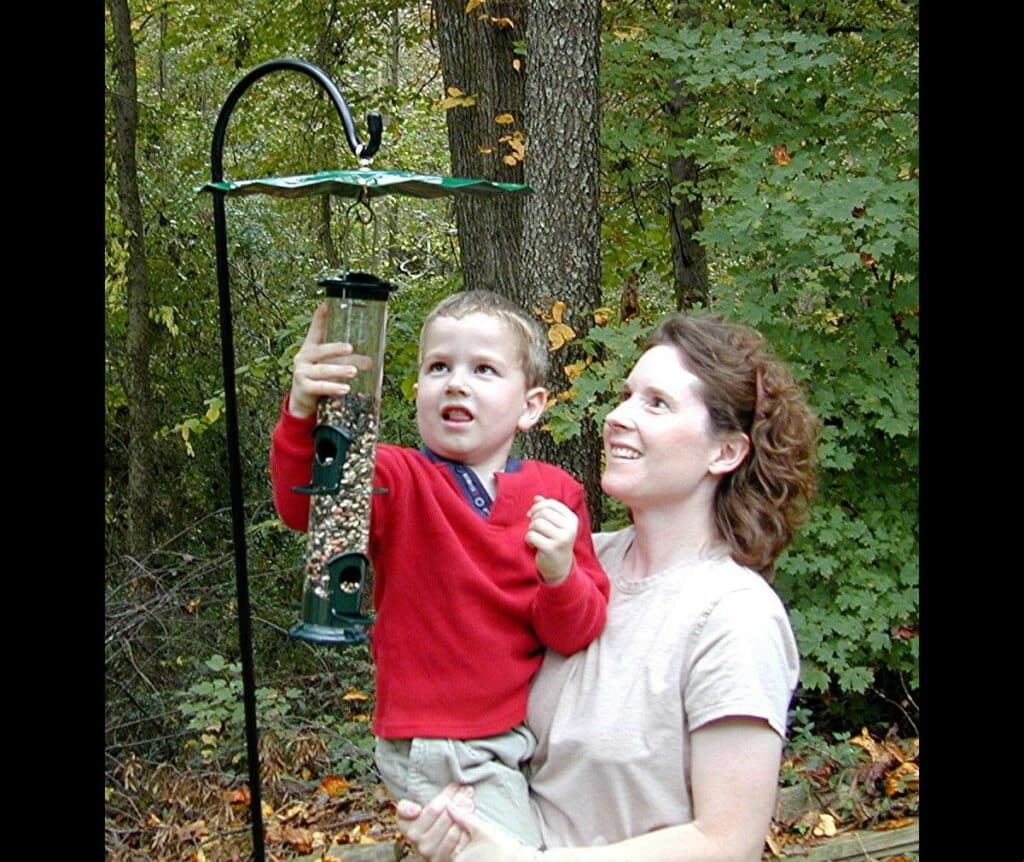 Mom and Child hanging the bird feeder