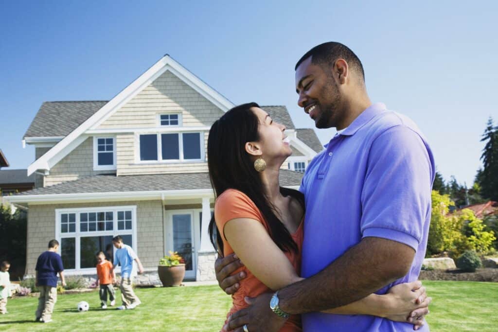 a couple in front of their home - American Home Service - Orlando FL