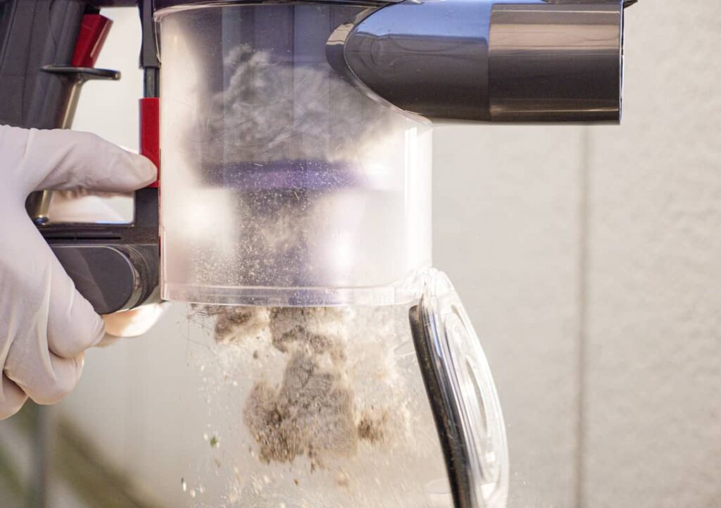 Emptying the Dyson over the garbage can is a good idea. 